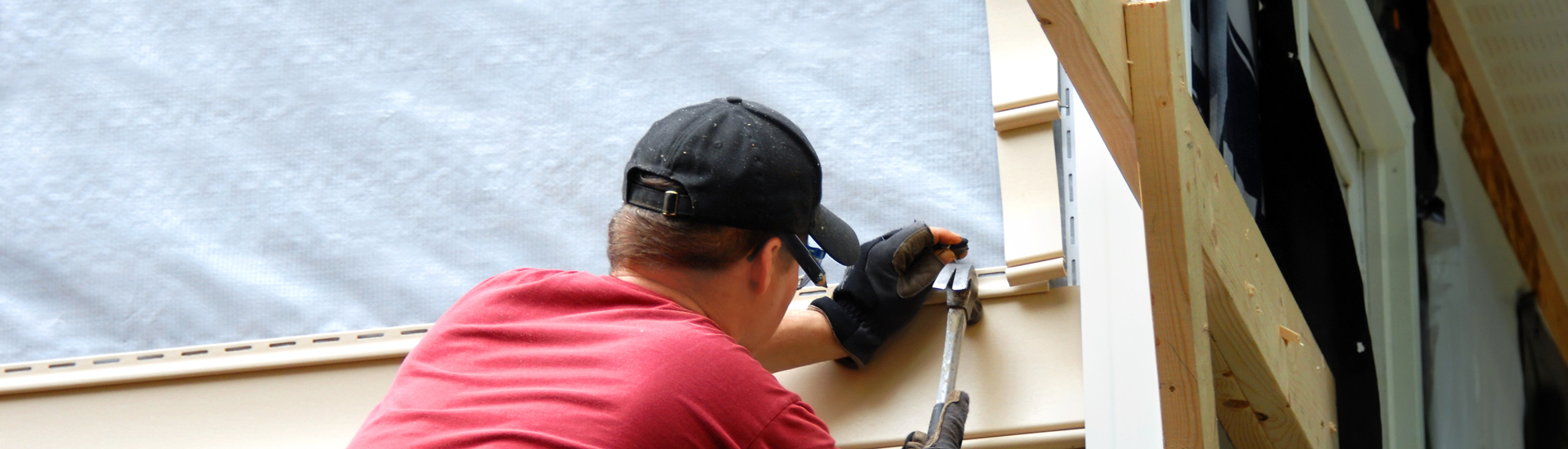 Man Repairing Window Exterior